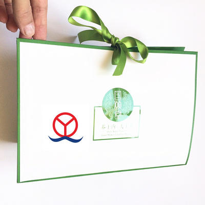 New White Custom Logo Printed Coated Cosmetic Gift Box/Paper Bag With Ribbon Closure