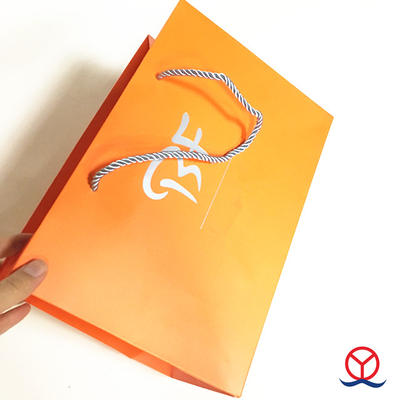 Orange color boutique logo recyclable reusable foldable custom printed paper straw shopping bag